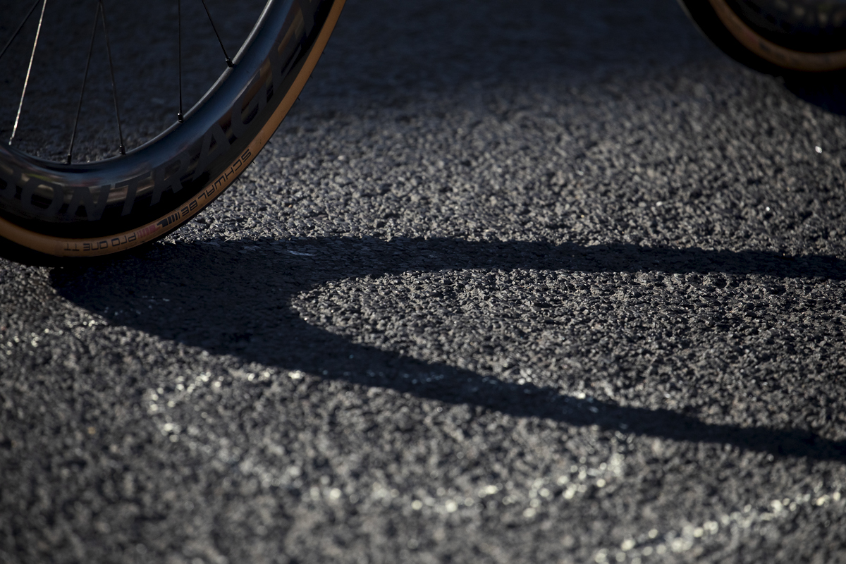 British National Road Championships 2024 - Men’s Road Race - Schwalbe Pro One TT - A bike wheel casts a shadow on the road