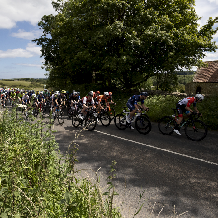 British National Road Championships 2024 - Men’s Road Race - The peloton passes by a small church in Upleatham