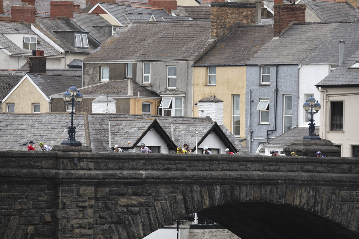 British National Road Championships 2025 - Road Race - Men - riders on the bridge in Aberystwyth with terraced housing in the background