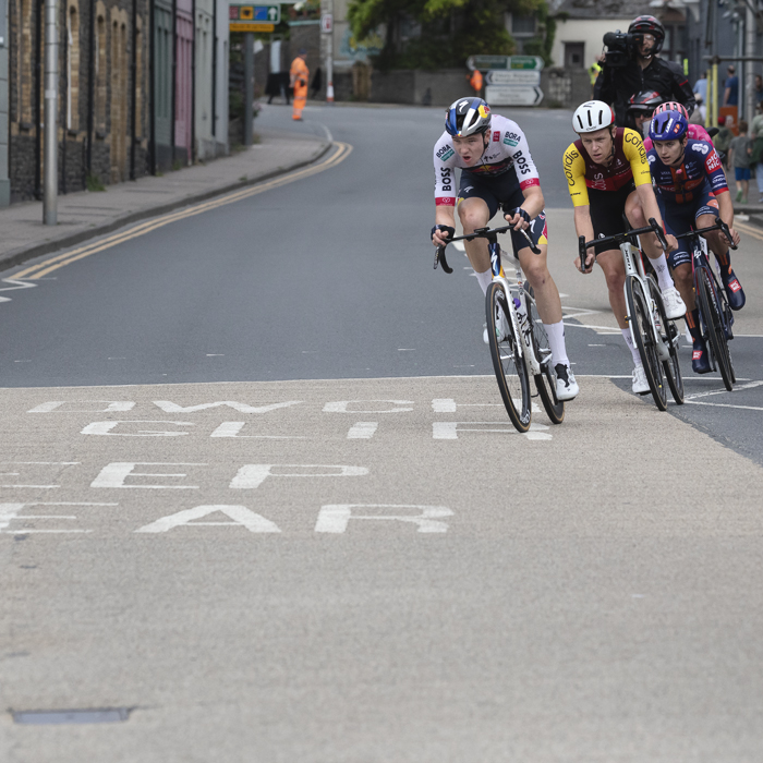 British National Road Championships 2025 - Road Race - Men - riders race through the streets of Aberystwyth