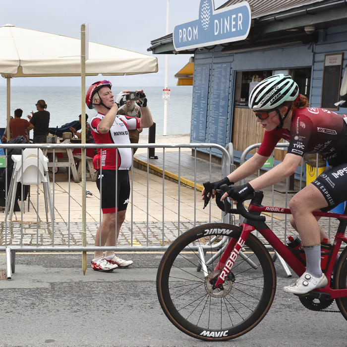British National Road Championships 2025 - Road Race - Women - A fan lifts his phone to line up a shot of Alice Colling of Smurfit Westrock Cycling Team