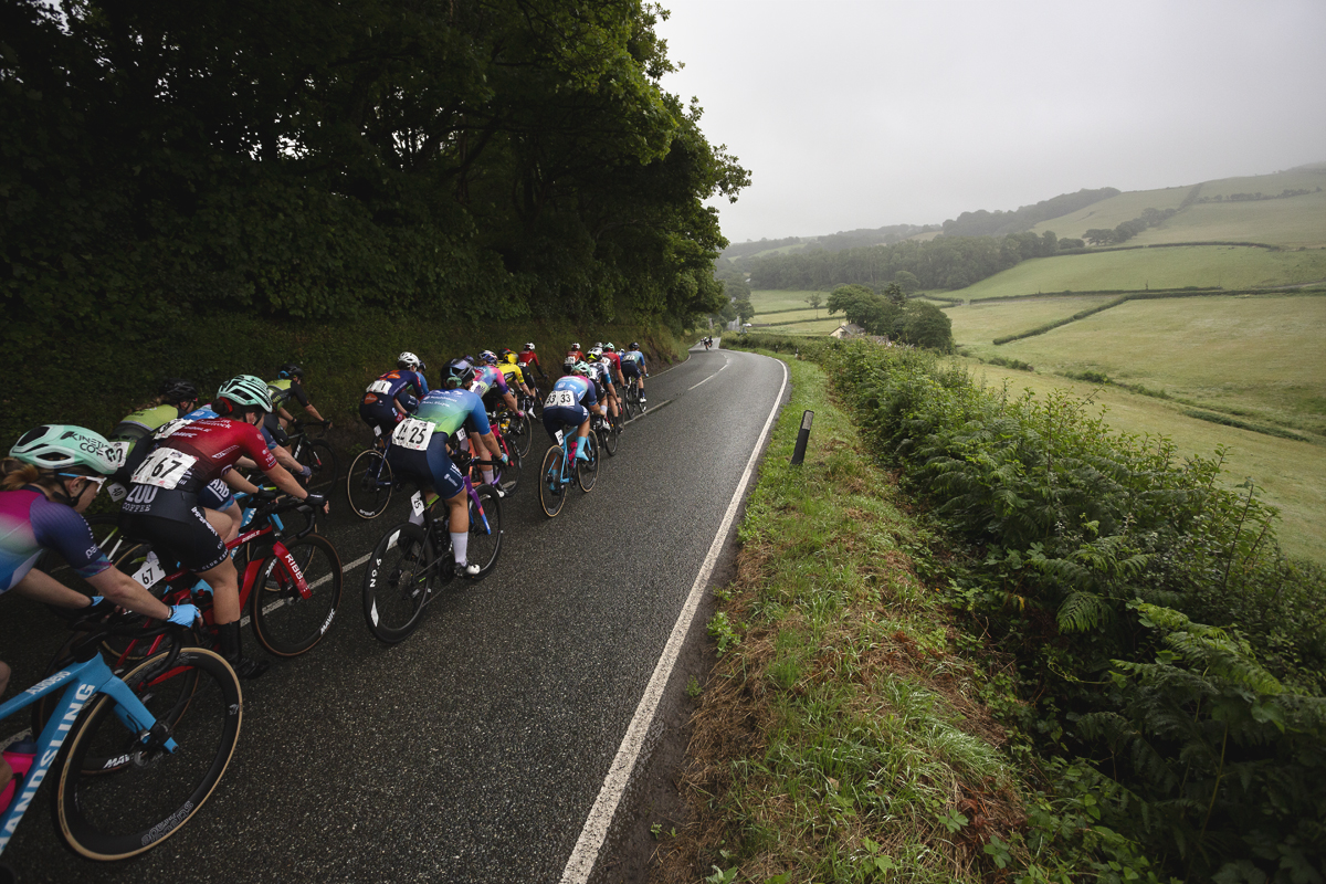 British National Road Championships 2025 - Road Race - Women - Rhydyfelin riders pass through the Welsh countryside with a view across fields to their right