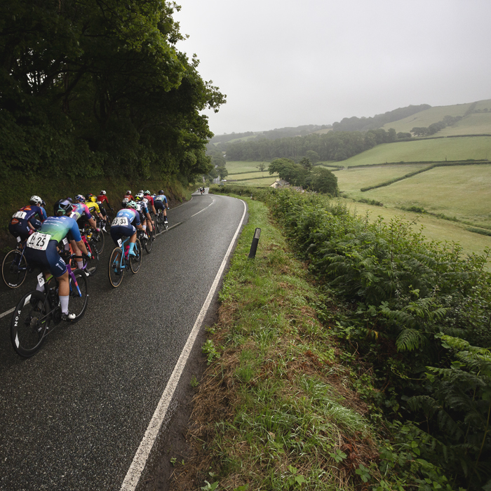British National Road Championships 2025 - Road Race - Women - Rhydyfelin riders pass through the Welsh countryside with a view across fields to their right