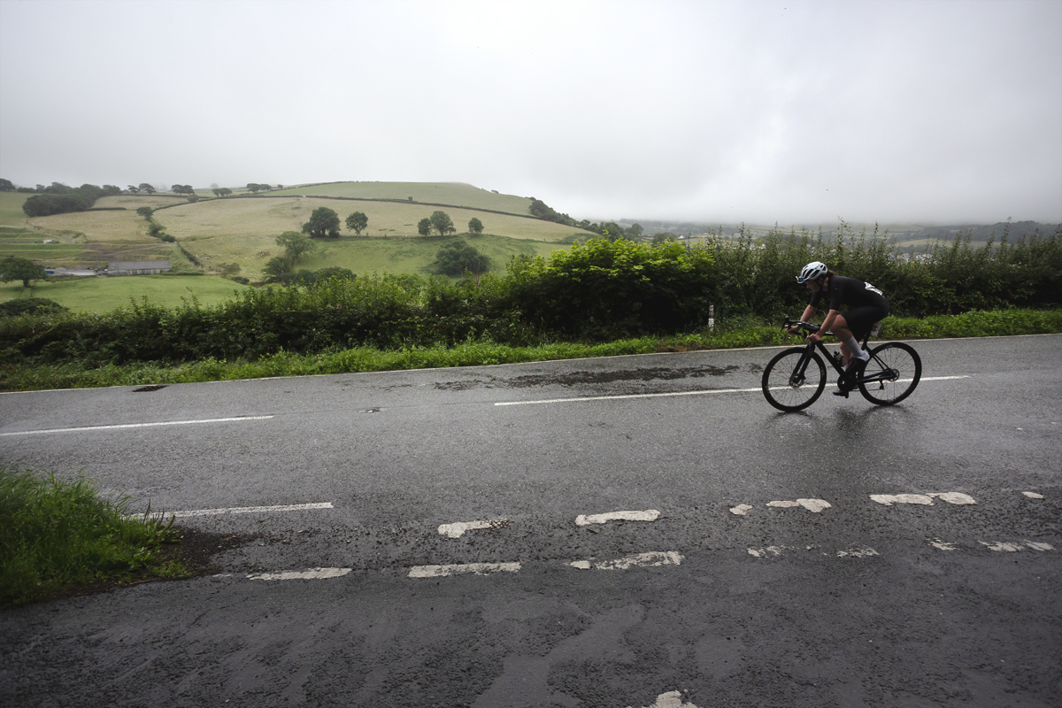 British National Road Championships 2025 - Road Race - Women - Lowri Richards from the side with rolling Welsh hills as a backdrop