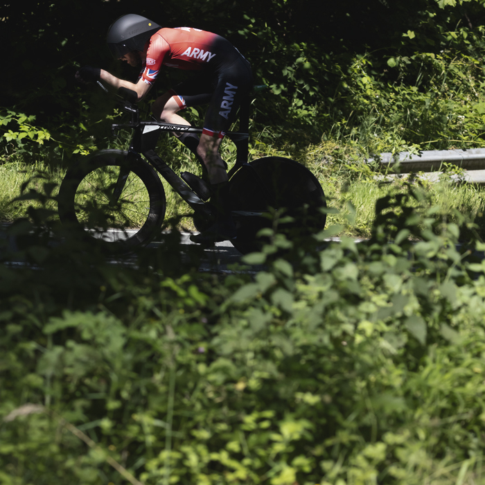 British National Road Championships 2025 - Time Trial - Elite Men - patches of light illuminate Jimmy Smith of Army Cycling Union as he rides through the countryside