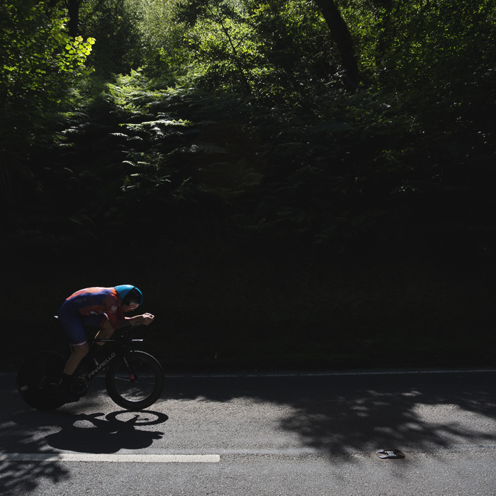 British National Road Championships 2025 - Time Trial - Elite Men - Matthew Rossiter of George Fox Cycling Solutions rides out of the shade of the trees and into a patch of light
