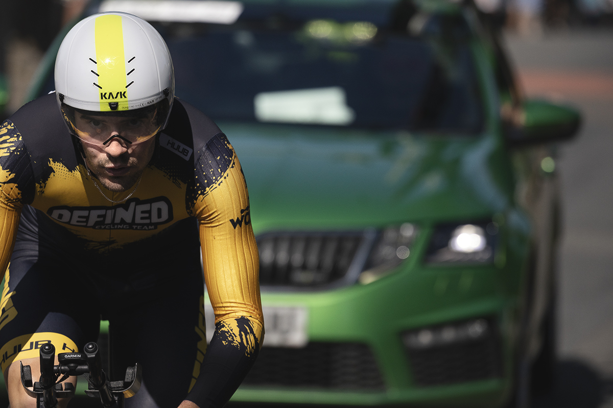 British National Road Championships 2025 - Time Trial - Elite Men - a close up of Timothy Torrie of Defined Cycling Team closely followed by his team car
