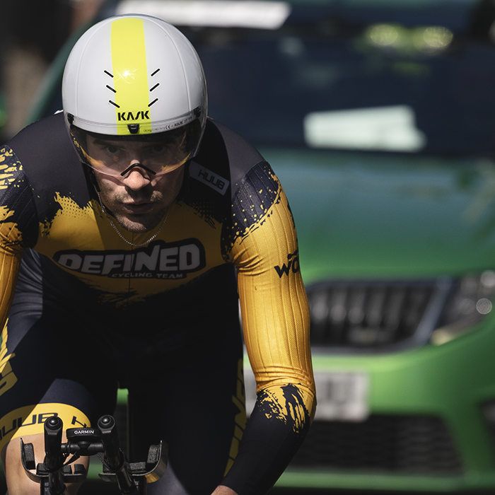 British National Road Championships 2025 - Time Trial - Elite Men - a close up of Timothy Torrie of Defined Cycling Team closely followed by his team car