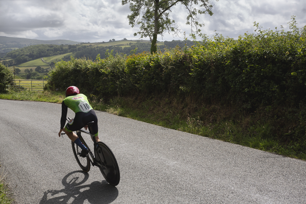 British National Road Championships 2025 - Time Trial - U23 Men - Jack Brough with views of the rolling Welsh hills in the background