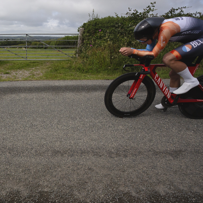 British National Road Championships 2025 - Time Trial - U23 Men - Toby Bush of BCC Race Team passes a field entrance
