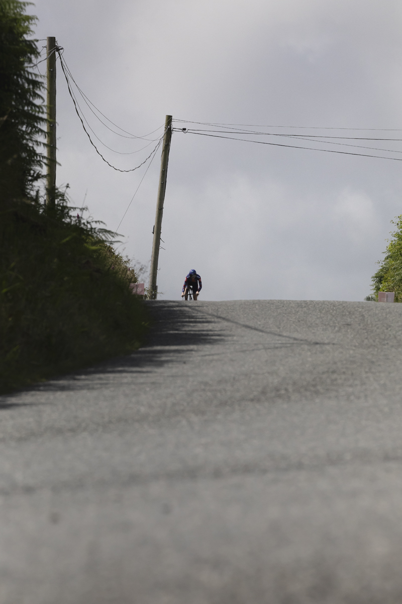 British National Road Championships 2025 - Time Trial - Elite Women - Josie Nelson crests a hill in the distance
