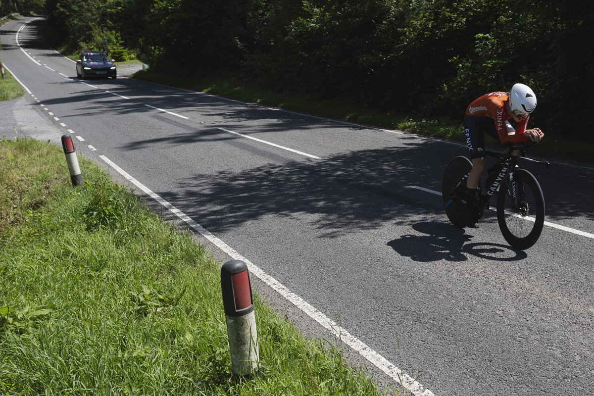 British National Road Championships 2025 - Time Trial - U23 Women - Millie Couzens of Fenix-Deceuninck rides through patches of light on the road