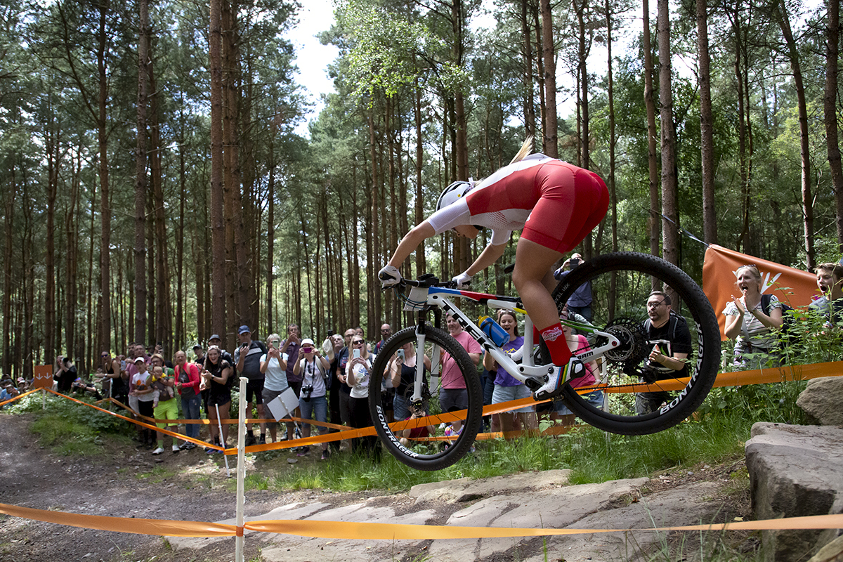 Birmingham 2022 - XXII Commonwealth Games - Mountain Bike - Women - Evie Richards of England takes a jump to the delight of the home crowd