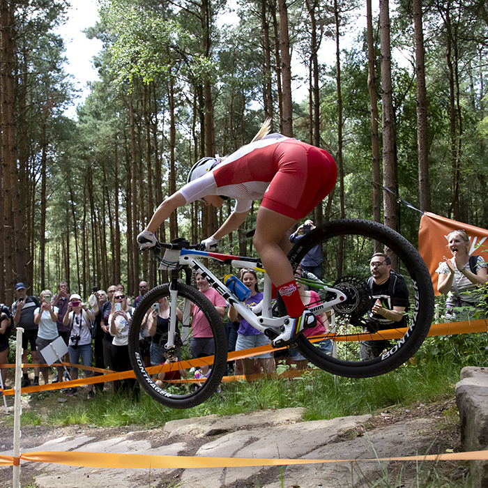 Birmingham 2022 - XXII Commonwealth Games - Mountain Bike - Women - Evie Richards of England takes a jump to the delight of the home crowd