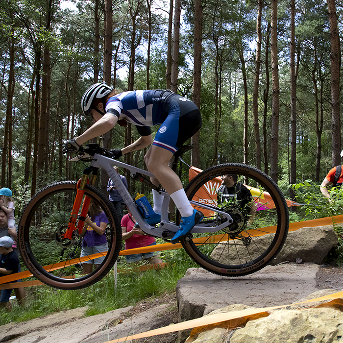 Birmingham 2022 - XXII Commonwealth Games - Mountain Bike - Women - Nancy Isla Short of Scotland jumps from a rocky outcrop
