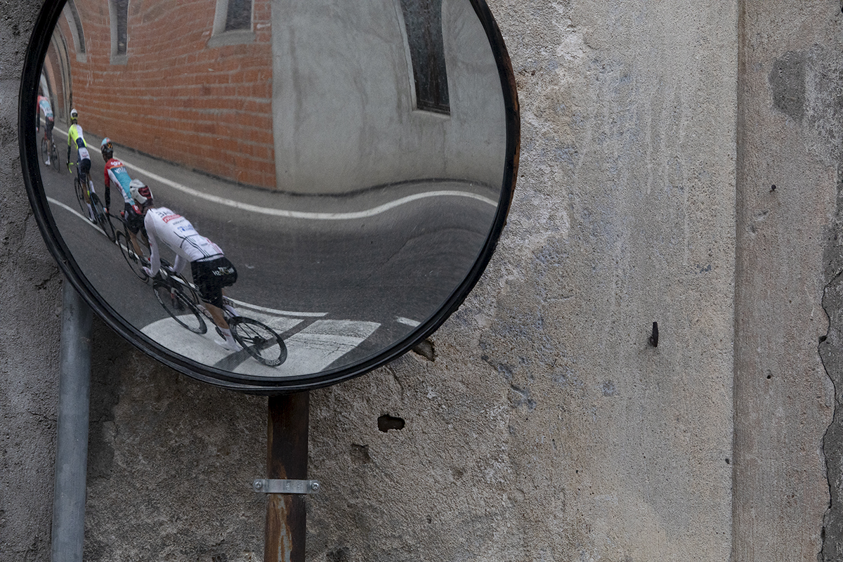 Coppa Bernocchi 2024 - Riders reflected in a roadside mirror in Castelseprio