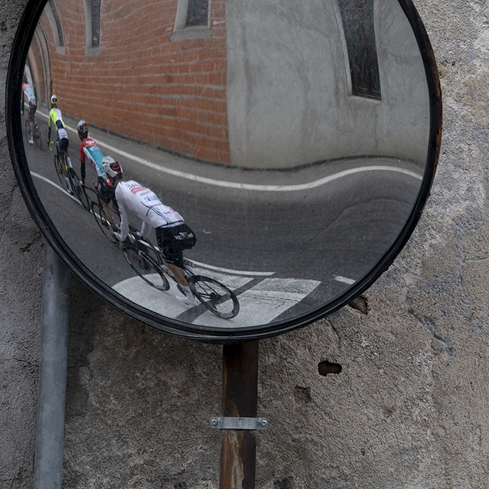 Coppa Bernocchi 2024 - Riders reflected in a roadside mirror in Castelseprio