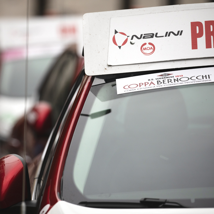 Coppa Bernocchi 2024 - Official Cars line the street prior to the start of the race