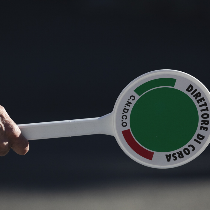 Coppa Bernocchi 2025 - A steward holds a sign aloft that reads Direttore di Corsa
