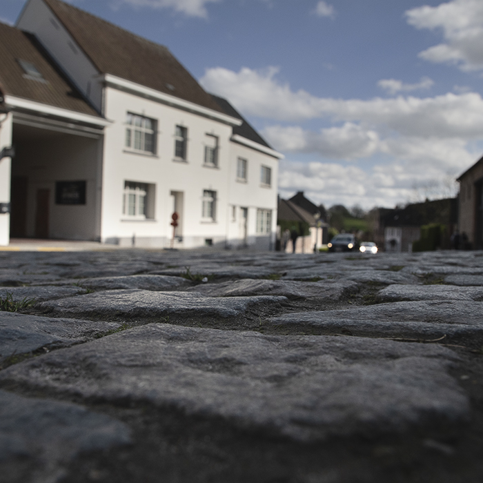 Dwars Door Vlaanderen 2024 - A low angle view of the main cobbled street through Nokere, Belgium