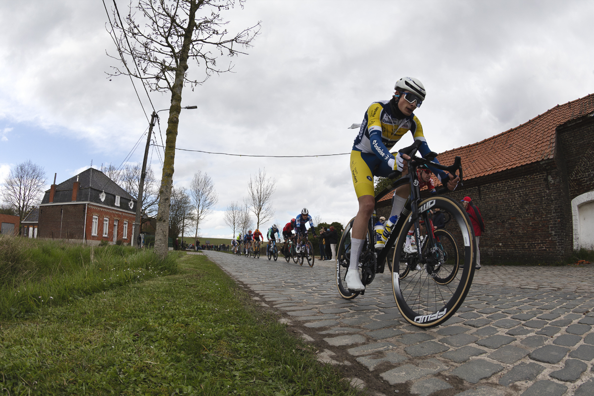 Dwars Door Vlaanderen 2024 - Victor Vercouillie of Team Flanders - Baloise races on the cobbles of Varentstraat