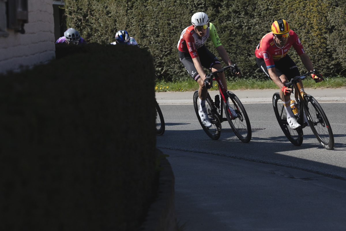 Dwars Door Vlaanderen 2025 - Alexander Kristoff and Roel van Sintmaartensdijk take a corner during the race