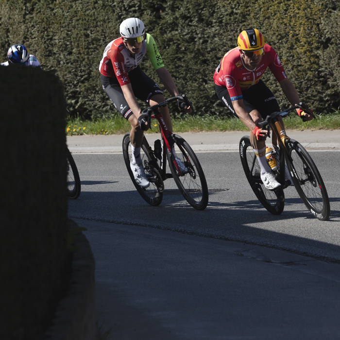 Dwars Door Vlaanderen 2025 - Alexander Kristoff and Roel van Sintmaartensdijk take a corner during the race