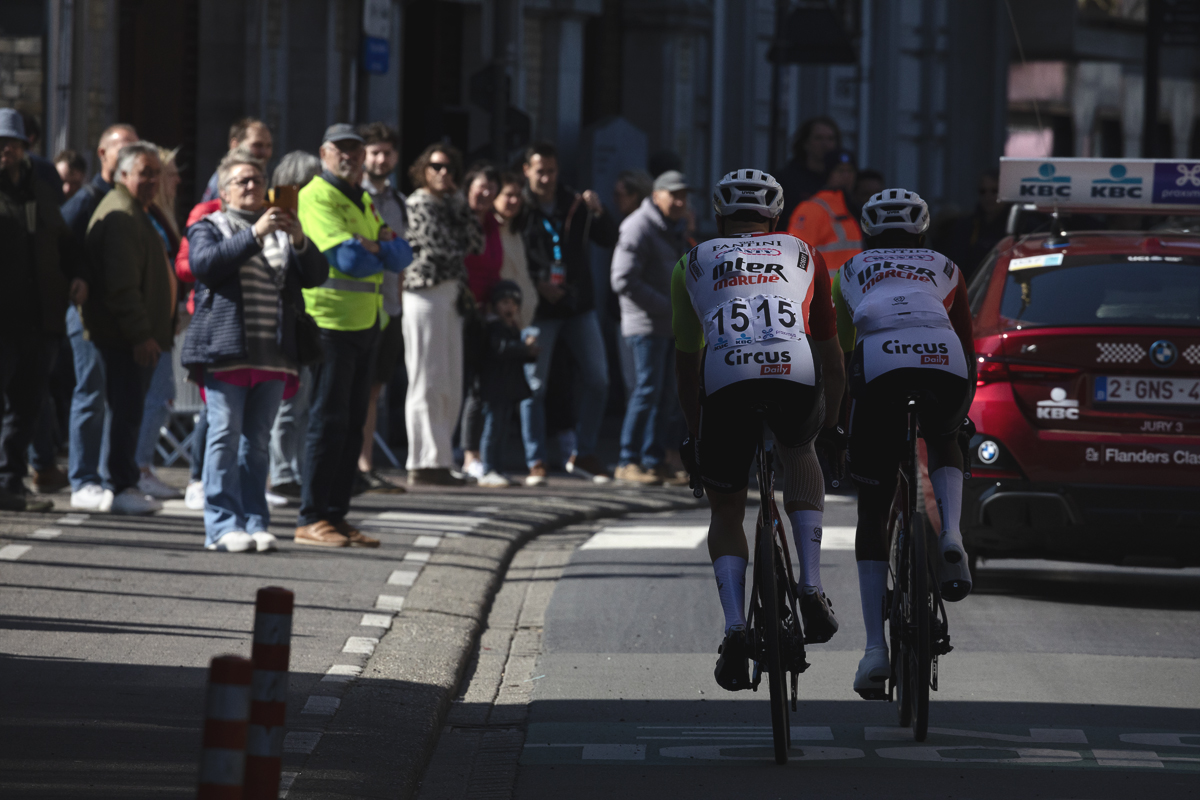 Dwars Door Vlaanderen 2025 - Hugo Page and Biniam Girmay follow the Race Director’s car during the neutralised start in Roselare