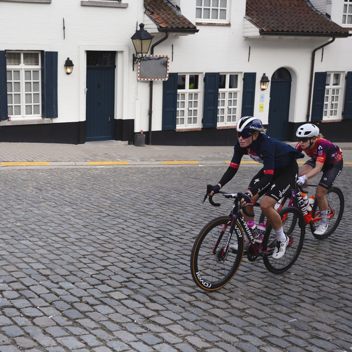 Dwars Door Vlaanderen Vrouwen 2024 - Demi Vollering & Daria Pikulik seen in Nokere with a white washed building behind them