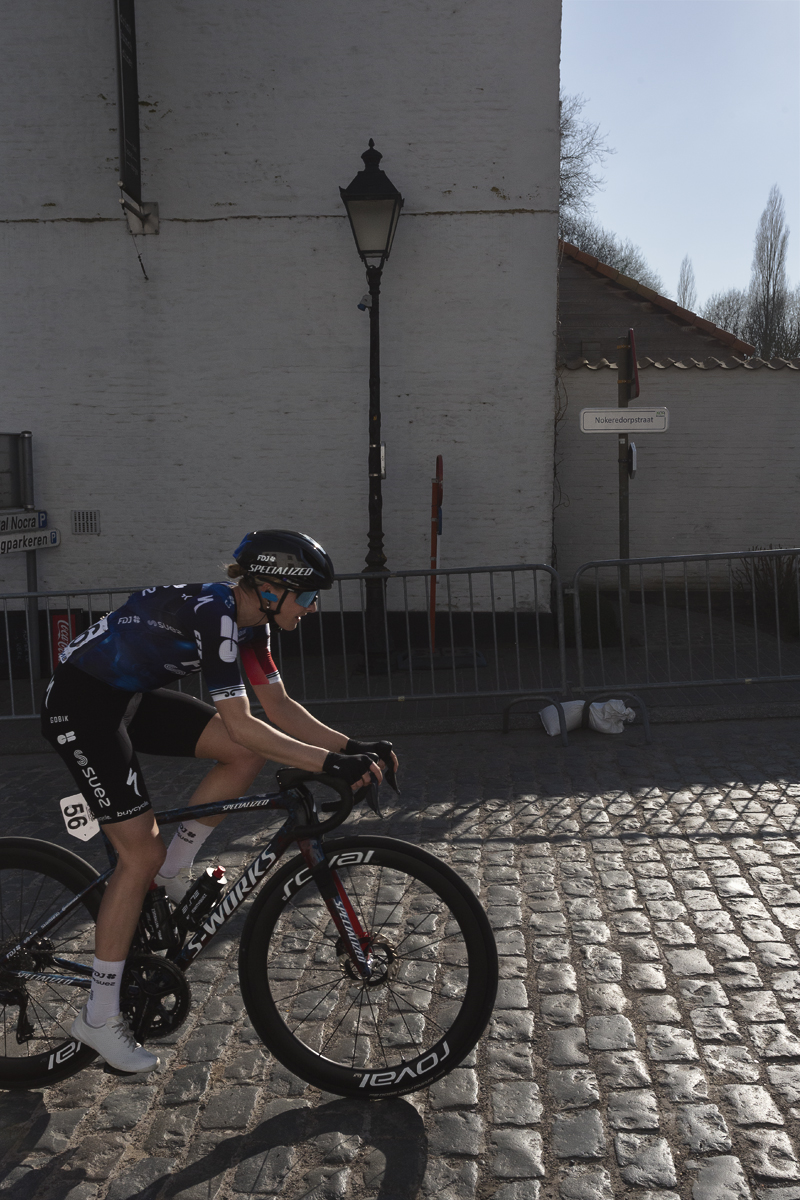 Dwars Door Vlaanderen Vrouwen 2025 - Ally Wollaston on the cobbles in the village of Nokere