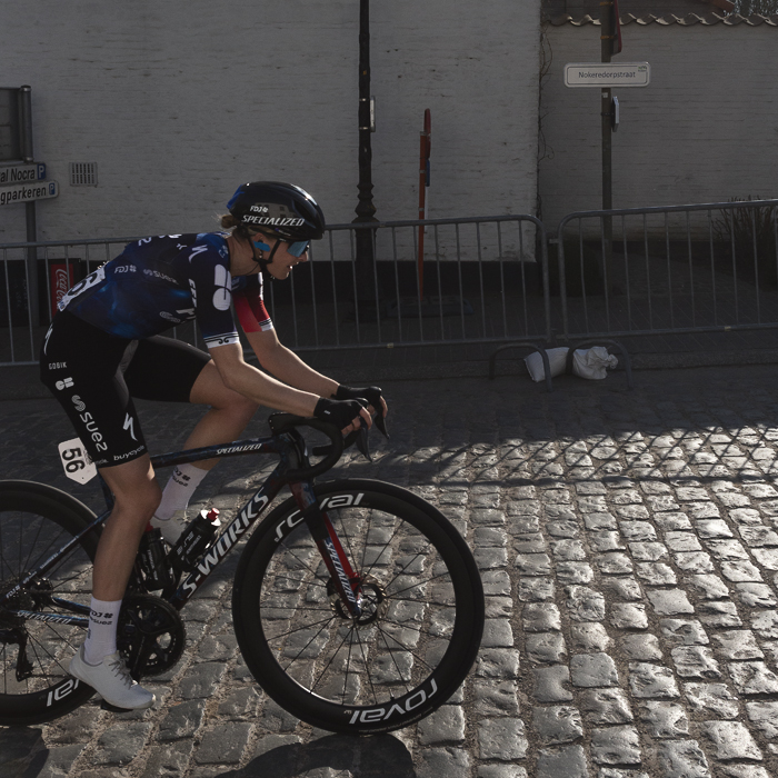 Dwars Door Vlaanderen Vrouwen 2025 - Ally Wollaston on the cobbles in the village of Nokere