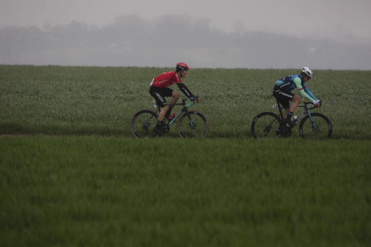 E3 Saxo Classic 2024 - Edvald Boasson Hagen and Miles Scotson seen on Aaste Heerweg with open fields in the foreground