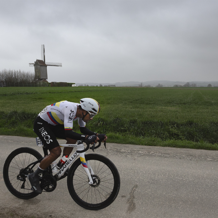 E3 Saxo Classic 2024 - Jhonatan Narváez on Langekouter with a windmill in the background