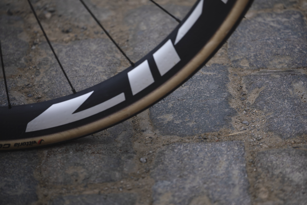 E3 Saxo Classic 2025 - A close up of a wheel on the cobbles of Stationberg