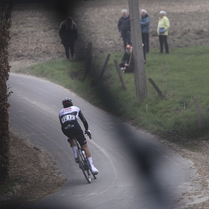 E3 Saxo Classic 2025 - Filippo Baroncini is framed by a bike frame on top of a team car