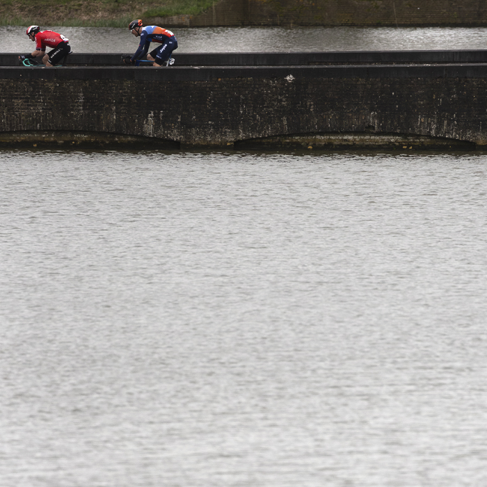 Gent Wevelgem 2024 - Arnaud Démare and Max Walscheid seen across the water