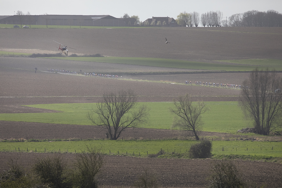 Gent Wevelgem 2025 - A helicopter flies above as riders tackle the Chemin des Alliés
