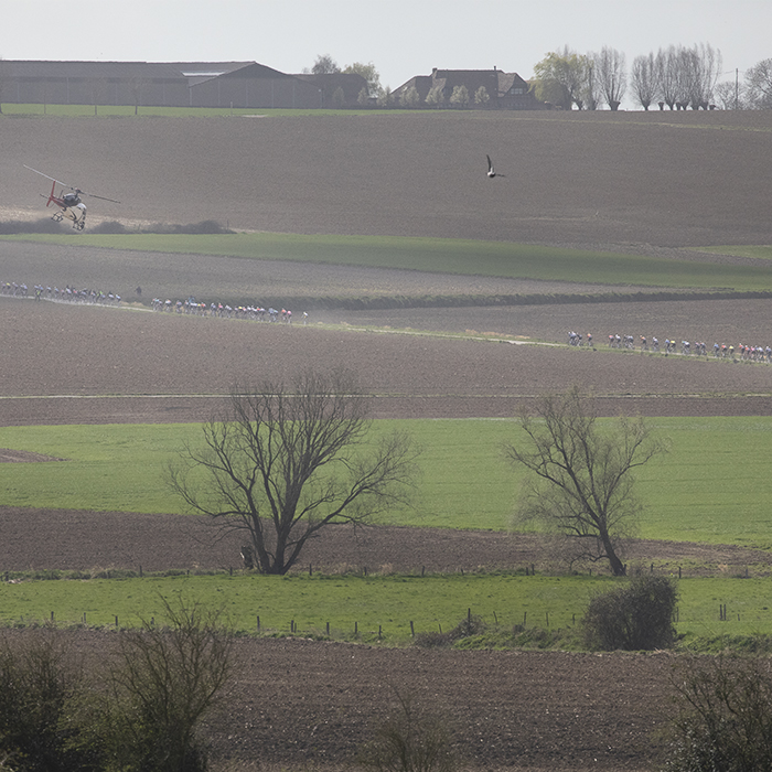 Gent Wevelgem 2025 - A helicopter flies above as riders tackle the Chemin des Alliés