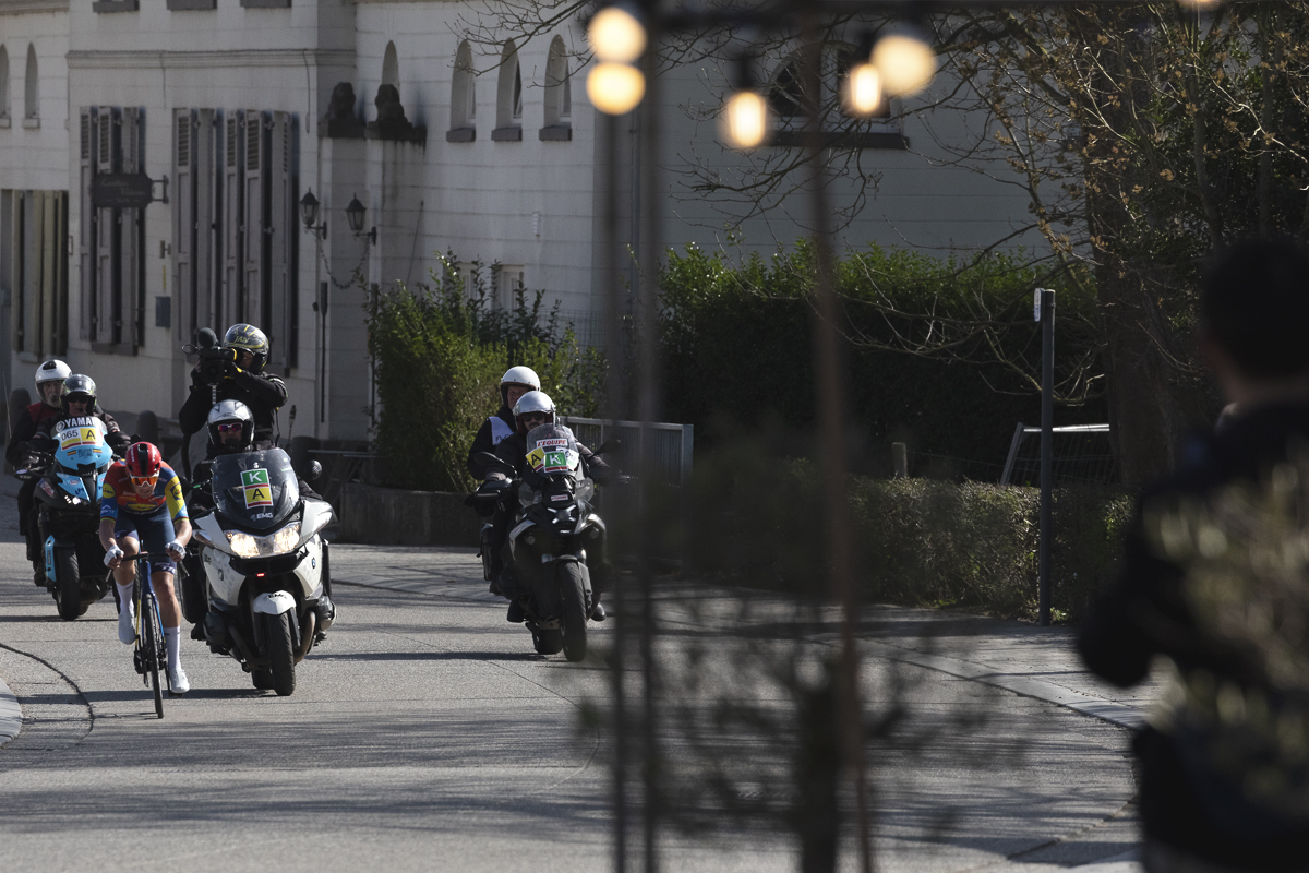 Gent Wevelgem 2025 - Mads Pedersen is followed closely by the TV Moto as he solos through Reningelst