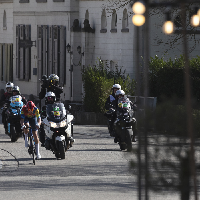 Gent Wevelgem 2025 - Mads Pedersen is followed closely by the TV Moto as he solos through Reningelst
