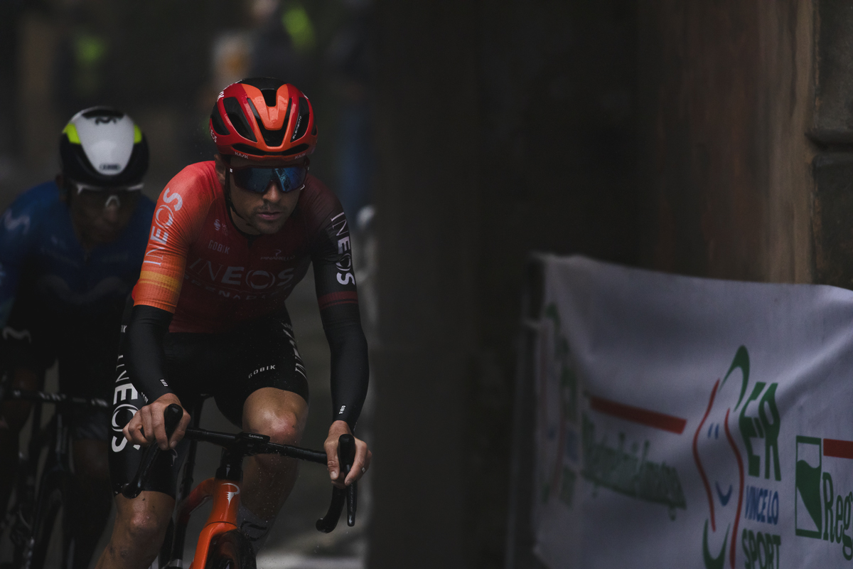 Giro dell’Emilia 2024 - Tom Pidcock rides under Arco Del Meloncello