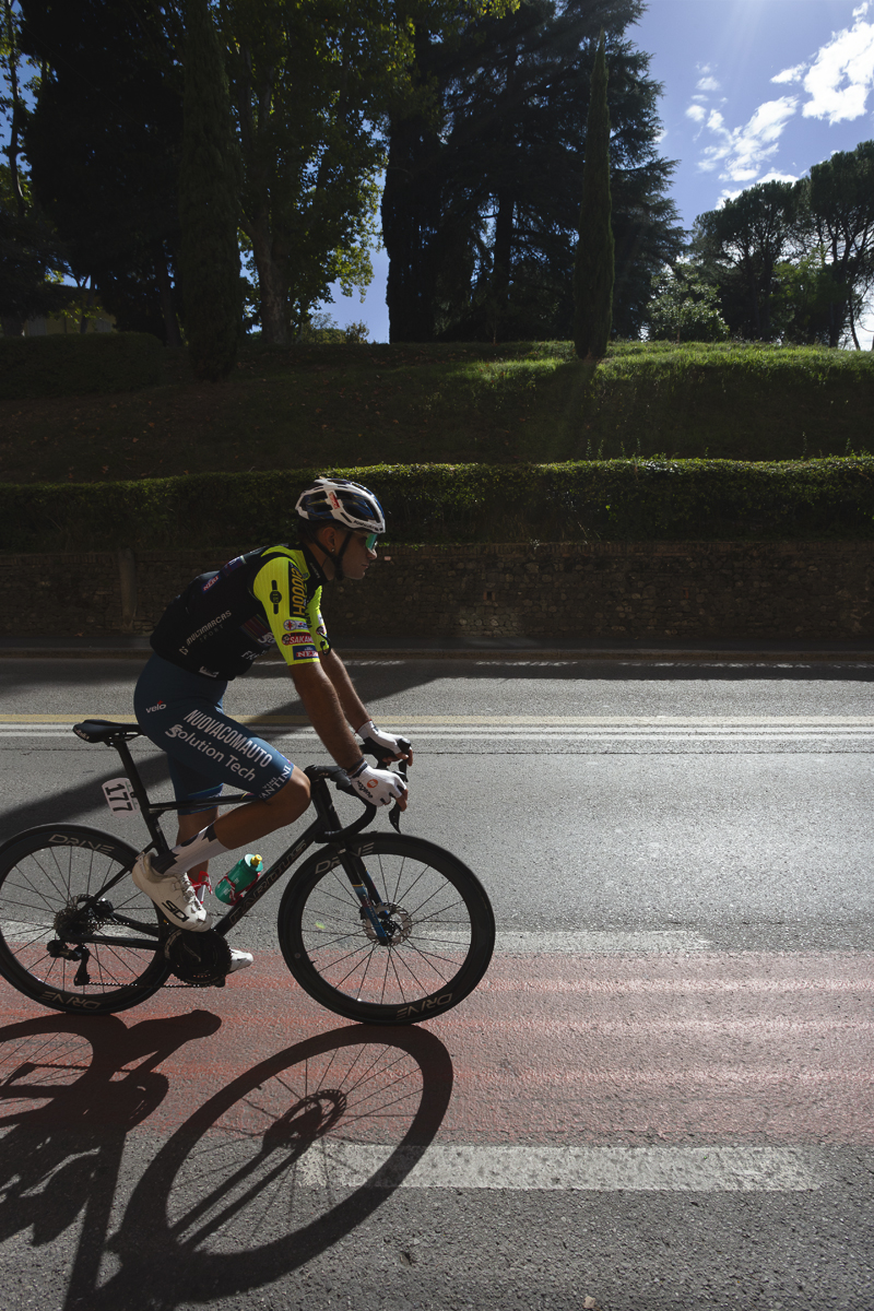Giro dell’Emilia 2025 - Andrea Piras follows a bike path painted on the road in Bologna