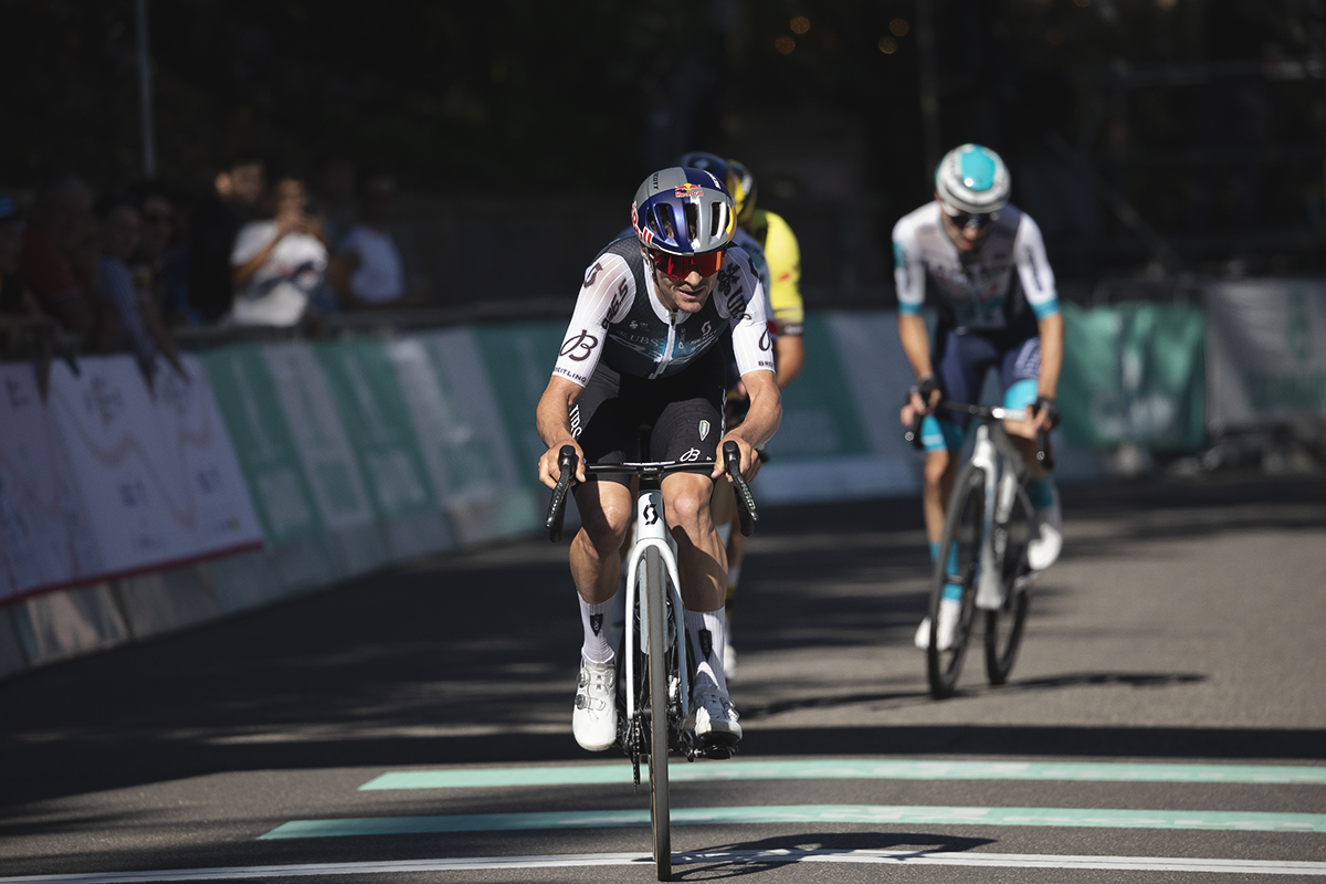 Giro dell’Emilia 2025 - Tom Pidcock pushes on as he crosses the finish line on one of the early laps