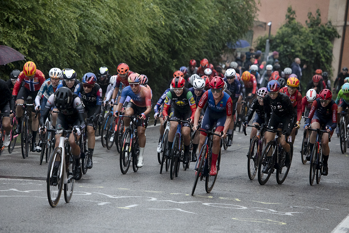 Giro dell'Emilia Internazionale Donne Elite 2024 - The peloton passes over writing on the road on Via di San Luca