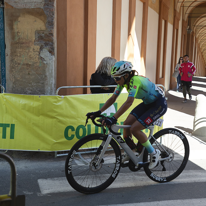 Giro dell'Emilia Internazionale Donne Elite 2025 - Irene Affolati passes under an archway of the portico on the San Luca climb