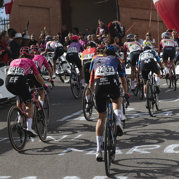 Giro dell'Emilia Internazionale Donne Elite 2025 - Riders seen from behind taking on the fan lined climb