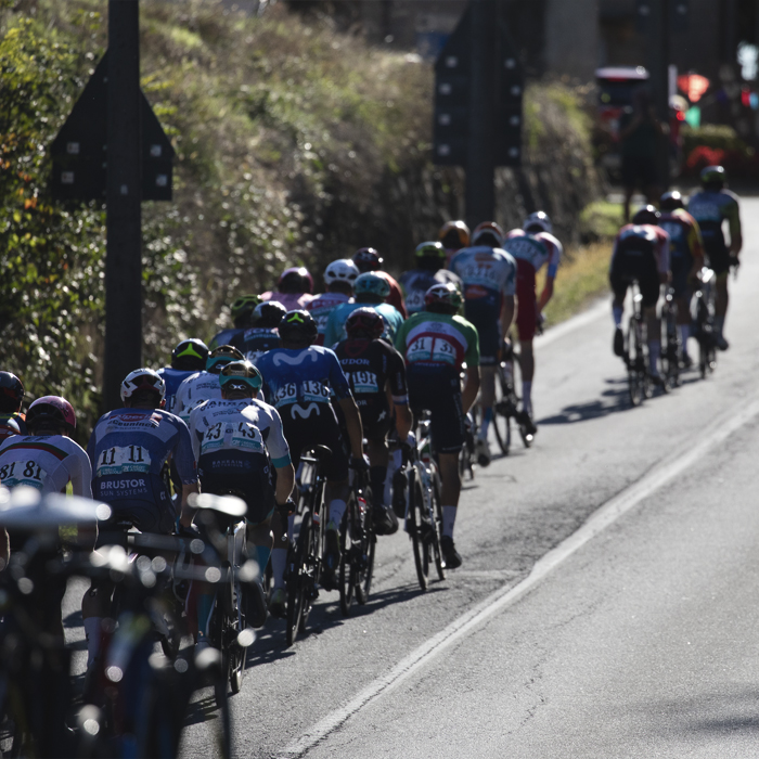Gran Piemonte 2024 - A group of riders from behind make their way off the climb into the settlement of Maggiora