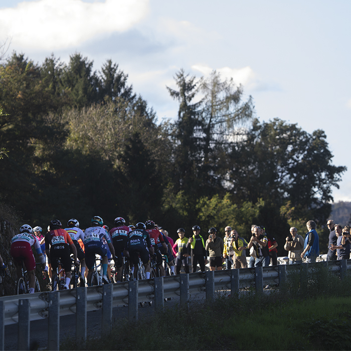 Gran Piemonte 2024 - The peloton viewed from behind as it climbs into Maggiora