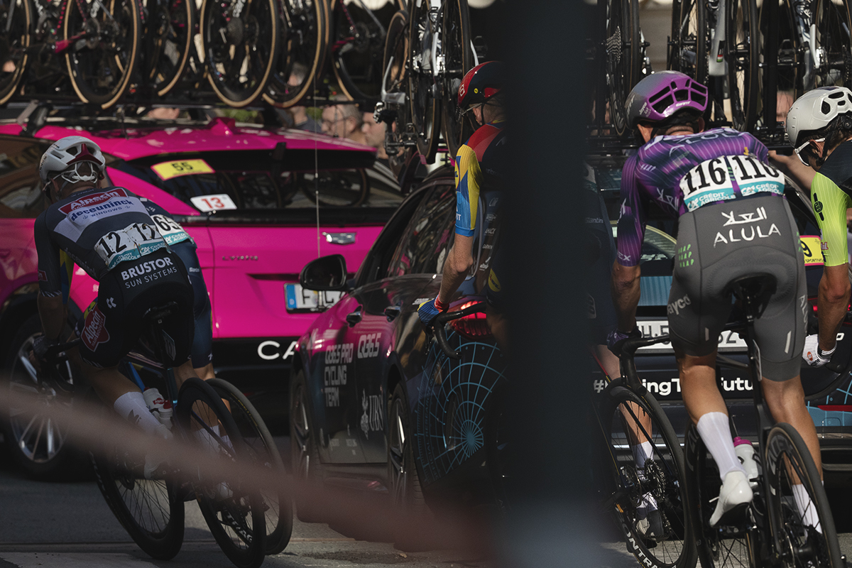 Gran Piemonte 2025 - Riders in the race convoy round a corner