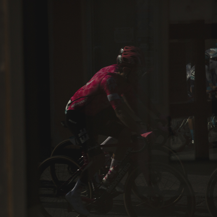 Gran Piemonte 2025 - A rider is reflected in a shop window in Acqui Terme